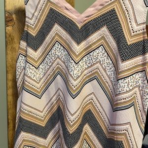 Maurice’s sleeveless v neck and back shirt. Size L